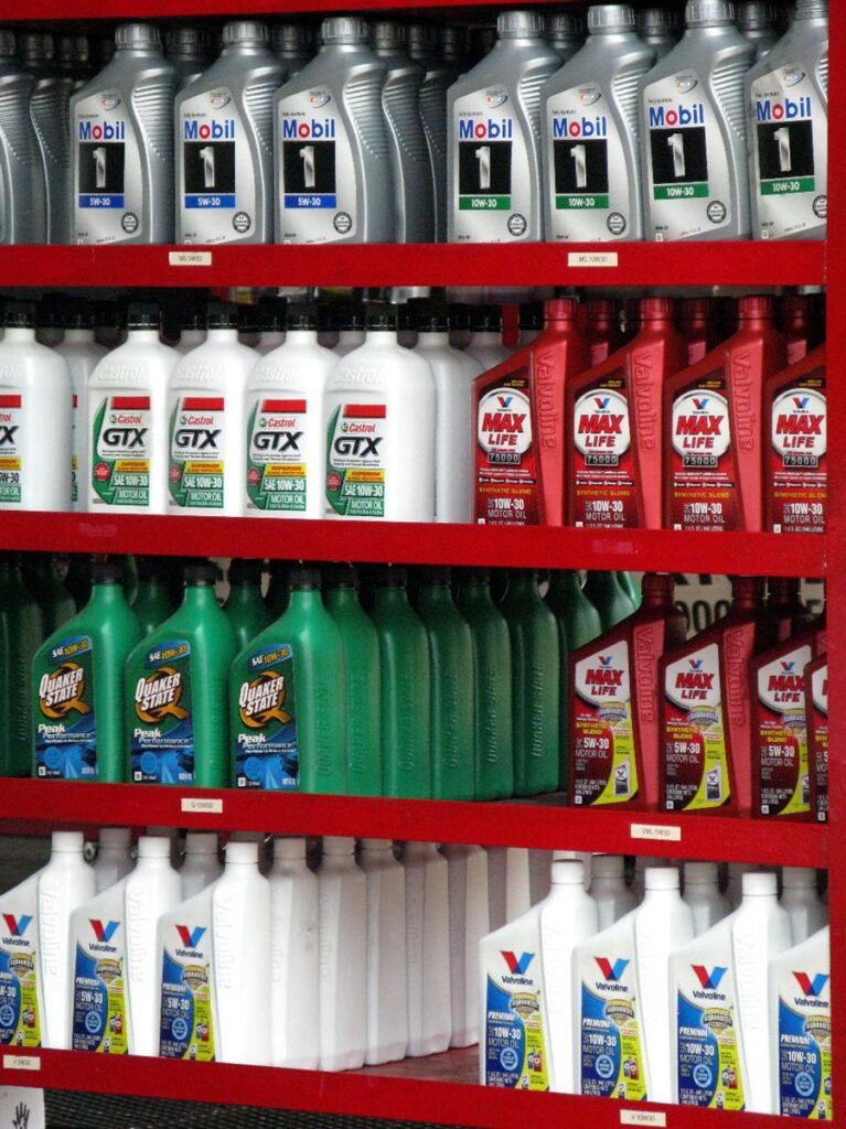 Engine oil bottles in a row on a shelf